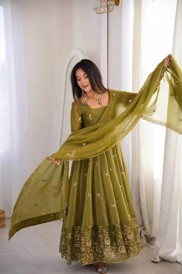 Flared_Olive_Green_Anarkali_Suit_With_Detailed_Floral_Embroidery_Along_The_Hem_And_Sleeves,_Paired_With_A_Matching_Dupatta