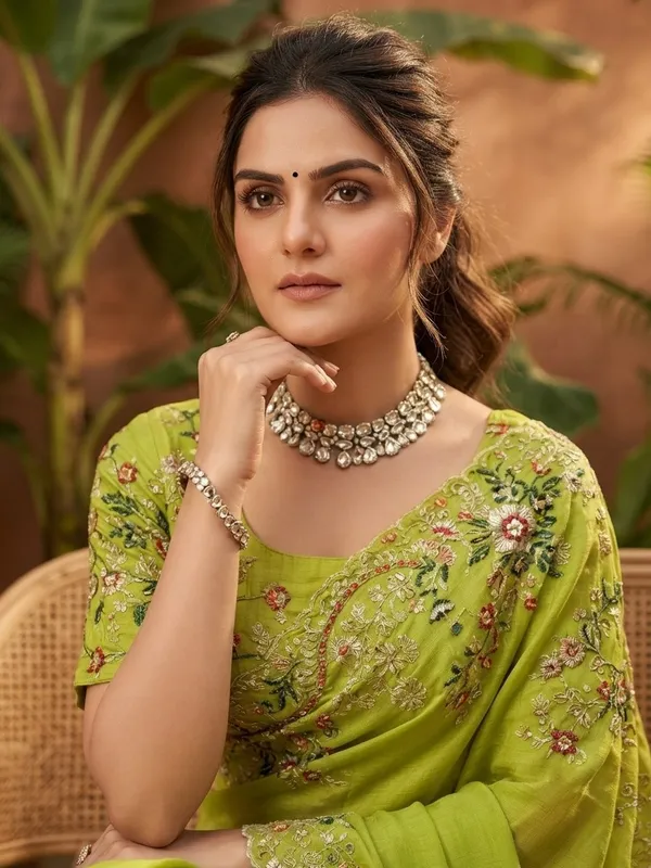 Green_Jimmy_Silk_Saree_Adorned_With_Intricate_Floral_Embroidery_And_A_Scalloped_Border