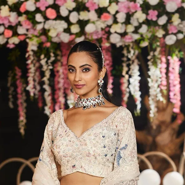Pastel-Toned,_Heavily_Embroidered_Lehenga_Featuring_Distinct_Peacock_Motifs_And_A_Sheer,_Sequin-Embellished_Dupatta