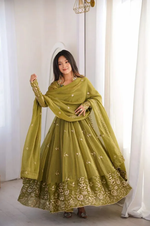 Flared_Olive_Green_Anarkali_Suit_With_Detailed_Floral_Embroidery_Along_The_Hem_And_Sleeves,_Paired_With_A_Matching_Dupatta