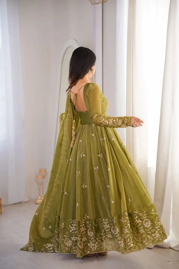Flared_Olive_Green_Anarkali_Suit_With_Detailed_Floral_Embroidery_Along_The_Hem_And_Sleeves,_Paired_With_A_Matching_Dupatta