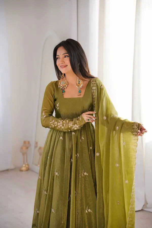 Flared_Olive_Green_Anarkali_Suit_With_Detailed_Floral_Embroidery_Along_The_Hem_And_Sleeves,_Paired_With_A_Matching_Dupatta