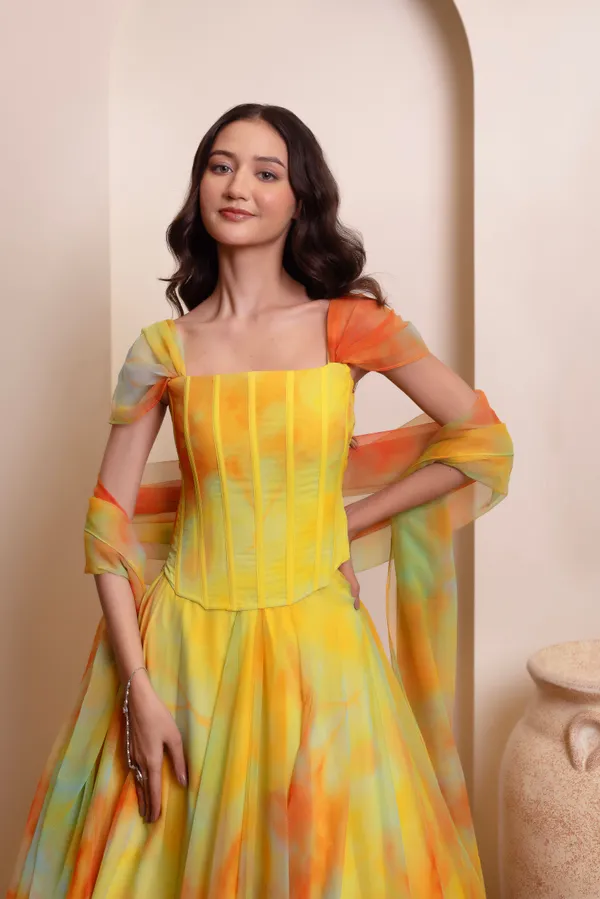 Ethnivo_Yellow_Orange_Chiffon_Party_Wear_Lehenga_Choli_With_Orange_Border
