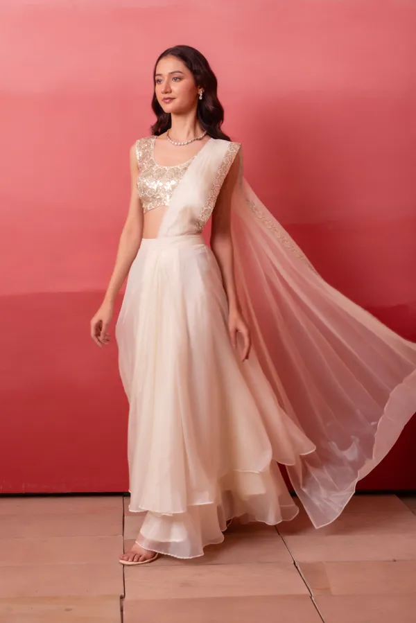 Ivory_White_Organza_Party_Wear_Lehenga_Choli_With_Golden_Embroidered_Border
