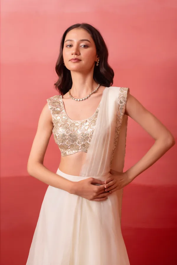 Ivory_White_Organza_Party_Wear_Lehenga_Choli_With_Golden_Embroidered_Border
