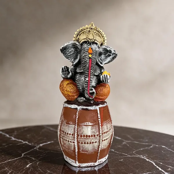 Black_And_Brown_Ganesha_Idol_On_Decorative_Pot