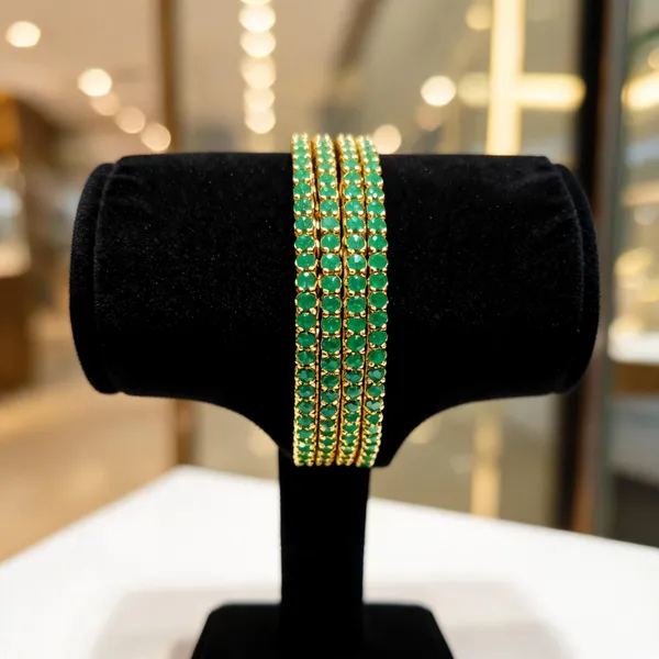 Gold_Alloy_Green_Stone_Studded_Layered_Bangle_Set_For_Women
