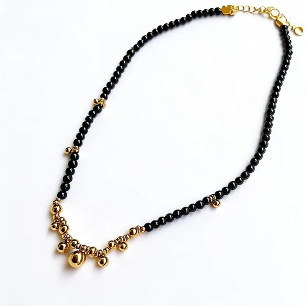 Black_Stone_With_Gold_Pearl_Necklace