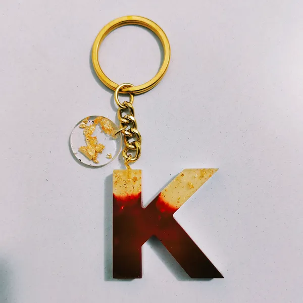Resin_Alphabate_'A'_Keychain
(Blue_Glitter_&_White_Resin+Golden_Ring+Tessel+Customised_Name_Sticker)