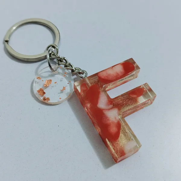 Resin_Alphabate_'A'_Keychain
(Blue_Glitter_&_White_Resin+Golden_Ring+Tessel+Customised_Name_Sticker)