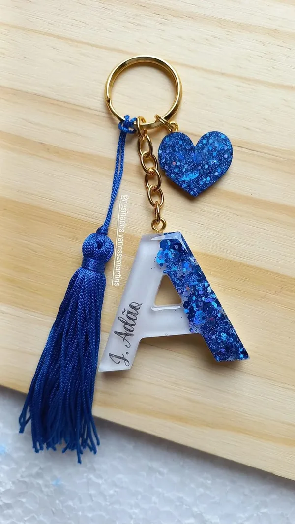 Resin_Alphabate_'A'_Keychain
(Blue_Glitter_&_White_Resin+Golden_Ring+Tessel+Customised_Name_Sticker)