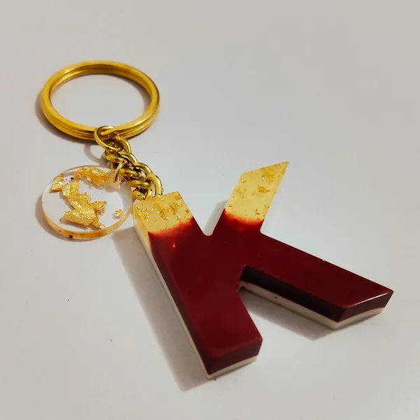 Resin_Alphabate_'A'_Keychain
(Blue_Glitter_&_White_Resin+Golden_Ring+Tessel+Customised_Name_Sticker)