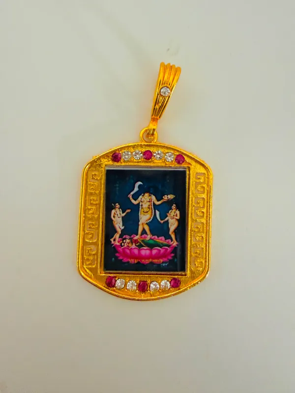 Gold_Tone_Hindu_Deity_Pendant_With_Red_And_Clear_Stones