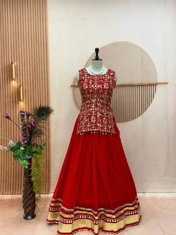 Red_And_Gold_Embellished_Chaniya_Choli_Features_Intricate_Traditional_Mirror_Work_And_Coin_Detailing_Along_The_Waist_And_Hem