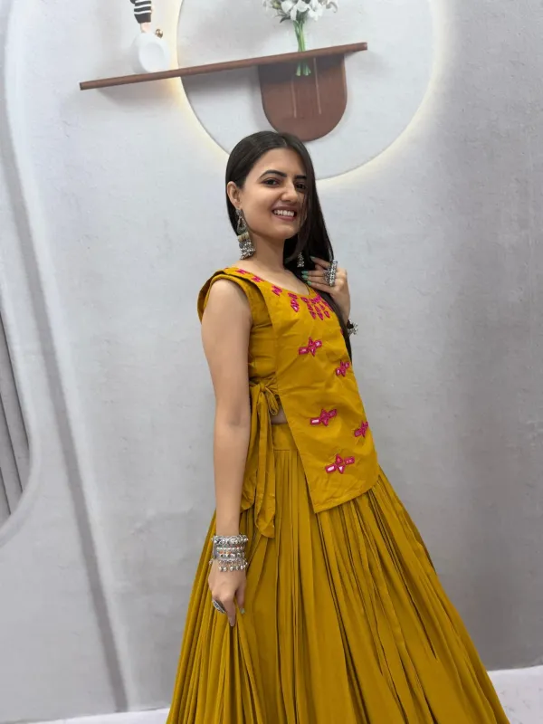 Navratri_Special_Mustard_Yellow_Flared_Pleated_Lehenga_Choli_Set_With_Pink_Mirror_Work_Embroidered_Jacket_Veronica_Fashion_Hub