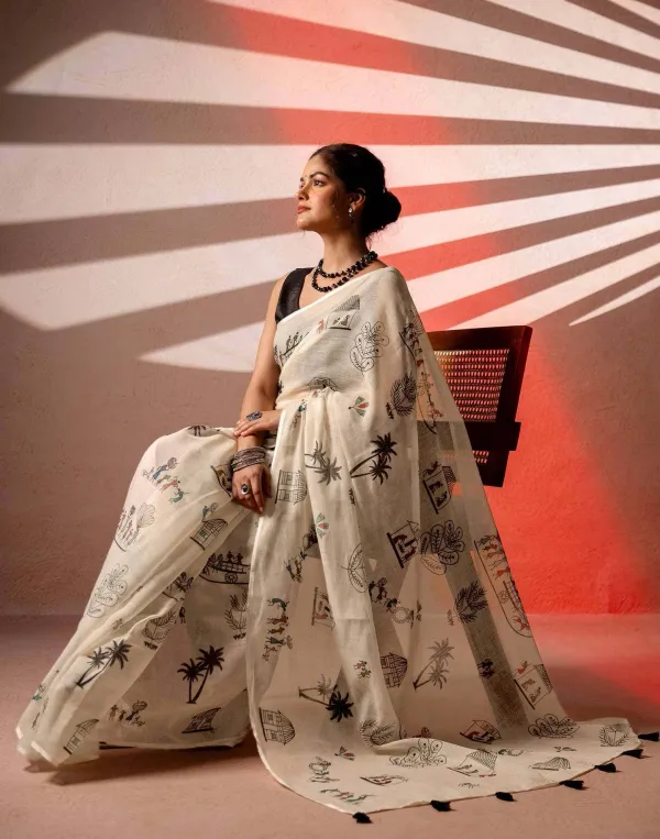 Off_White_Linen_Saree_Features_A_Unique_Black_Warli_Tribal_Art_Print_Depicting_Village_Scenes