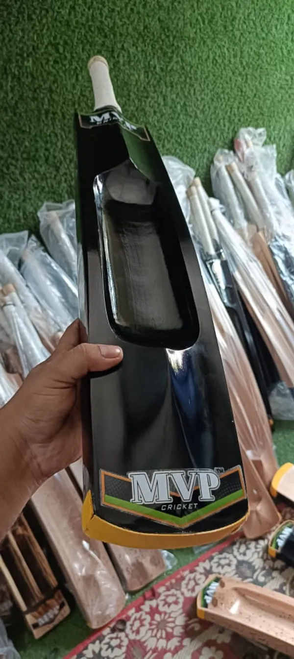 Black_Cricket_Bat_With_Taped_Handle