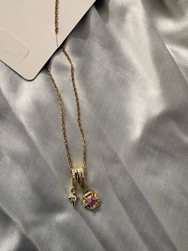 Gold_Tone_Cross_And_Pink_Stone_Pendant_Necklace