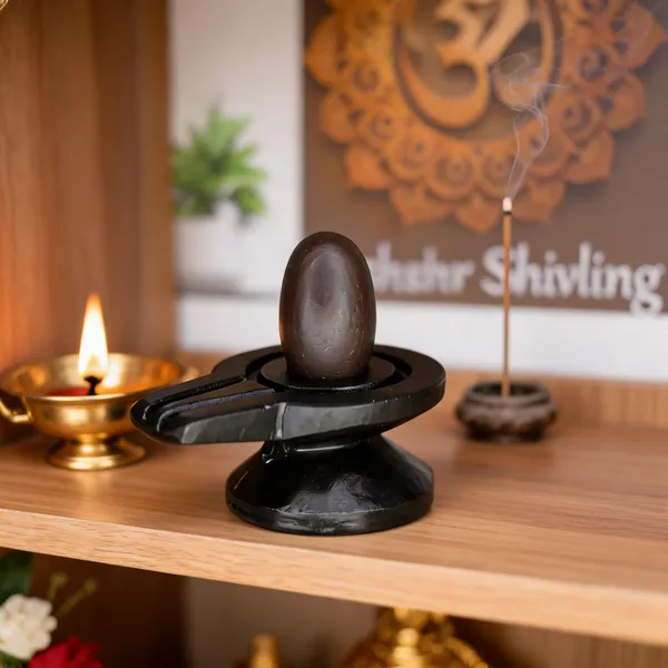 Narmada_Stone_Black_Shivling_With_Damru_Jaladhari_2_Inch