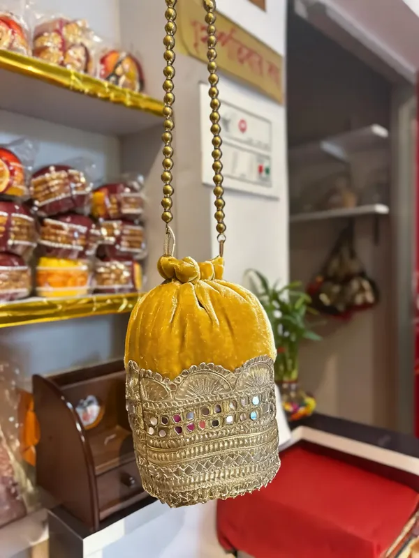 Yellow_Georgette_Stone_Embellished_Bridal_Potli_Bag_For_Women