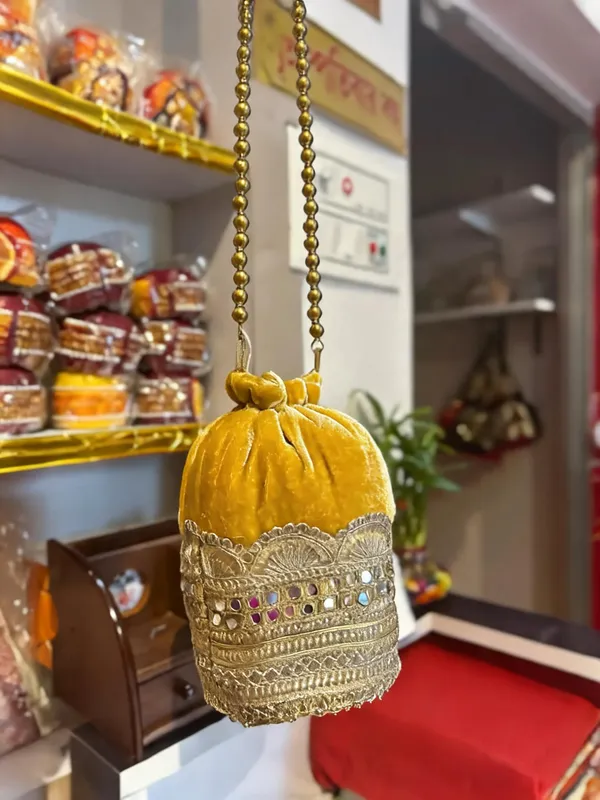 Yellow_Georgette_Stone_Embellished_Bridal_Potli_Bag_For_Women