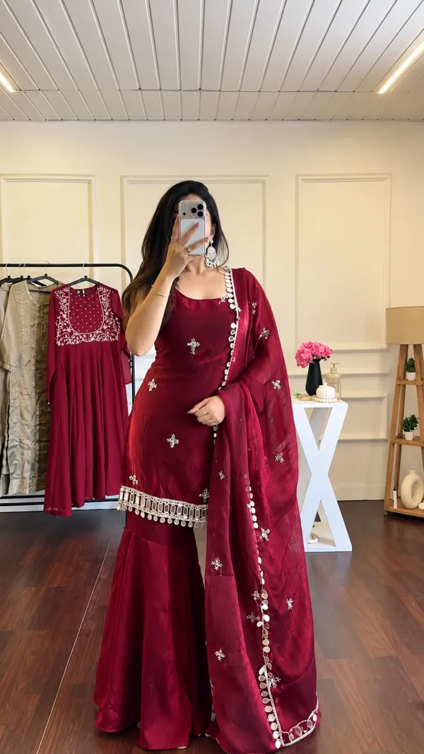 Elegant_Maroon_Silk_Saree_with_Embroidered_Border_&_Traditional_Embellishments