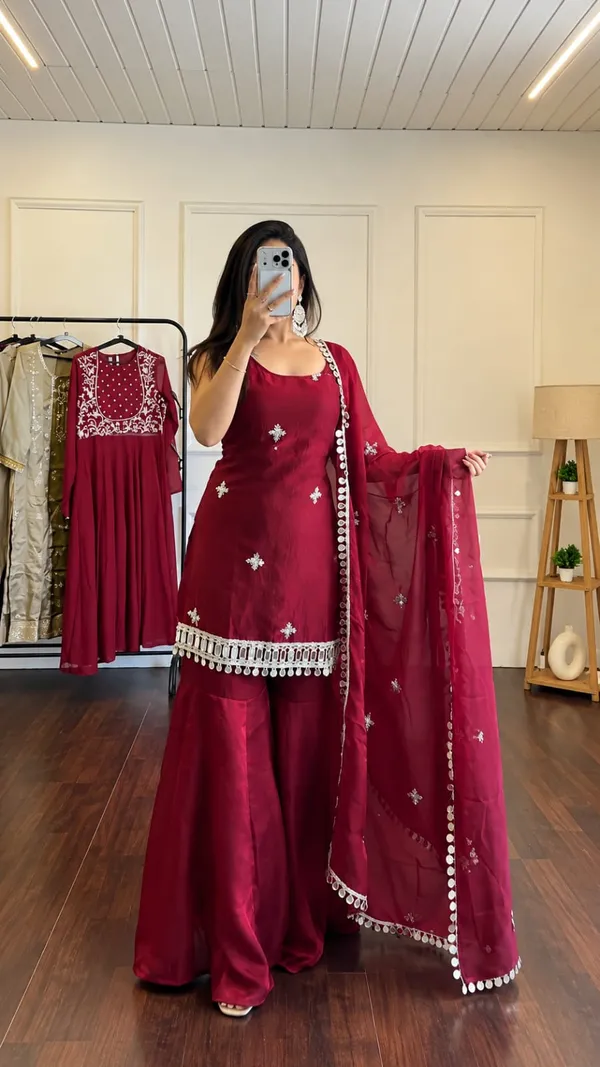 Elegant_Maroon_Silk_Saree_with_Embroidered_Border_&_Traditional_Embellishments
