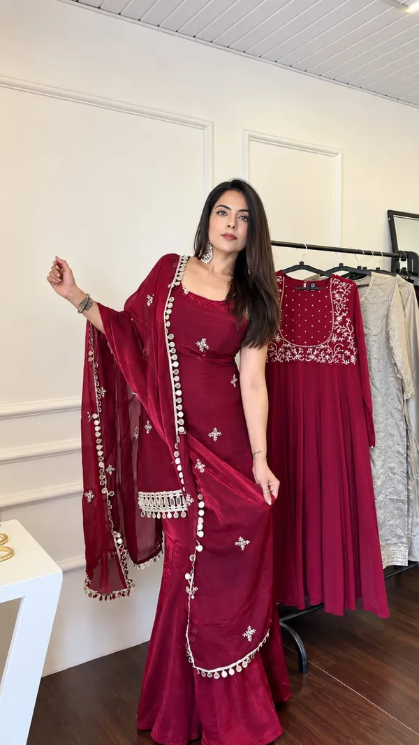 Elegant_Maroon_Silk_Saree_with_Embroidered_Border_&_Traditional_Embellishments
