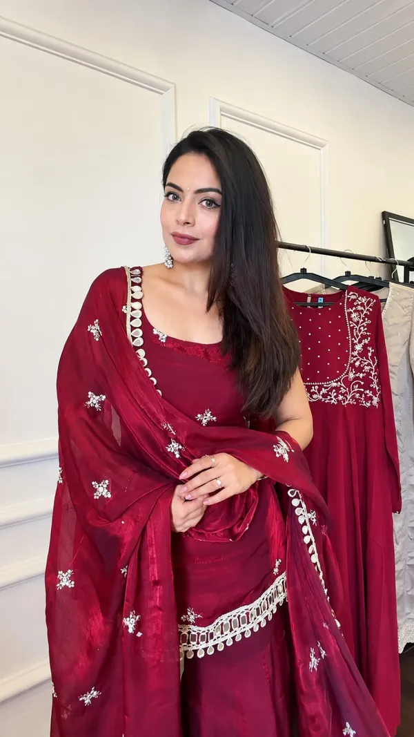 Elegant_Maroon_Silk_Saree_with_Embroidered_Border_&_Traditional_Embellishments