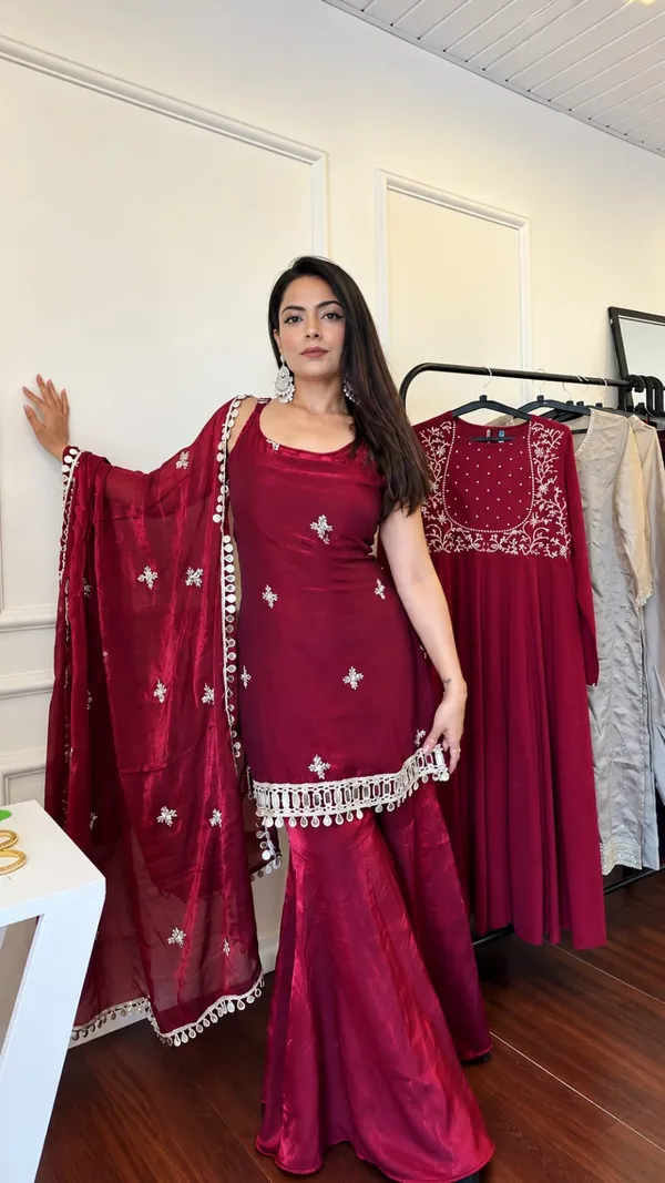 Elegant_Maroon_Silk_Saree_with_Embroidered_Border_&_Traditional_Embellishments