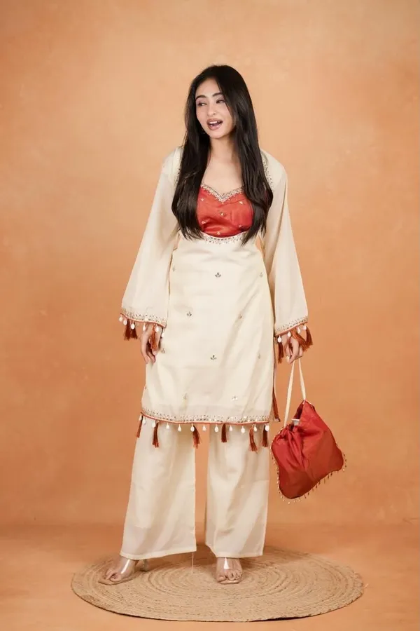 Elegant_Silk_Co-Ord_Set_–_Embroidered_Kurta,_Flared_Pants_&_Potli_Bag