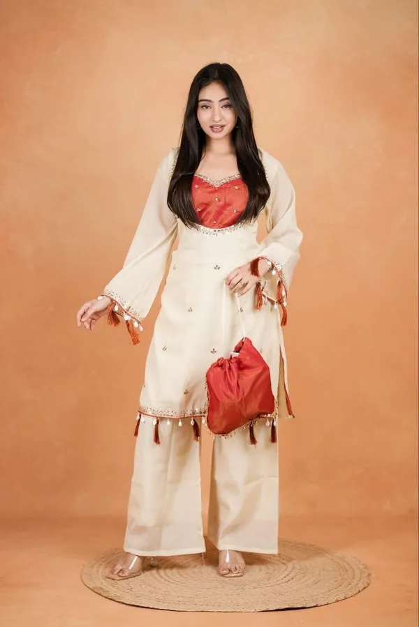 Elegant_Silk_Co-Ord_Set_–_Embroidered_Kurta,_Flared_Pants_&_Potli_Bag