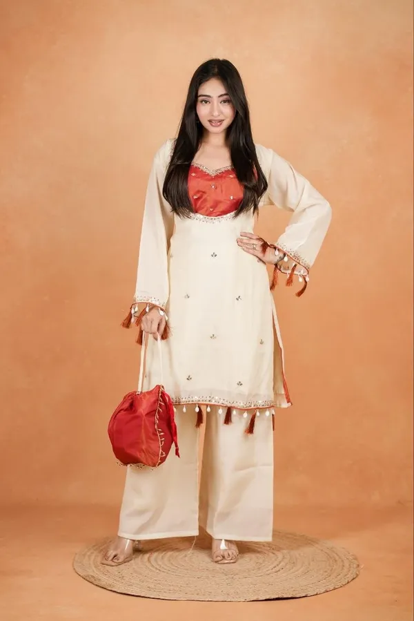 Elegant_Silk_Co-Ord_Set_–_Embroidered_Kurta,_Flared_Pants_&_Potli_Bag