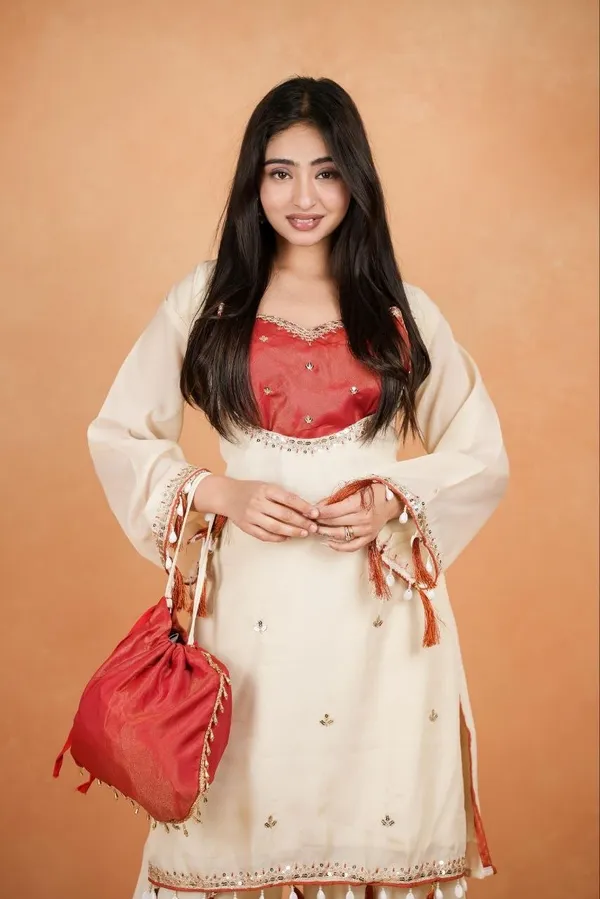 Elegant_Silk_Co-Ord_Set_–_Embroidered_Kurta,_Flared_Pants_&_Potli_Bag