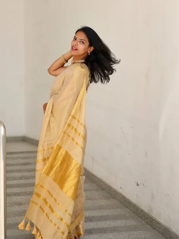 Golden_Beige_Soft_Linen_Saree_With_Zari_Stripes_Tassel_Border