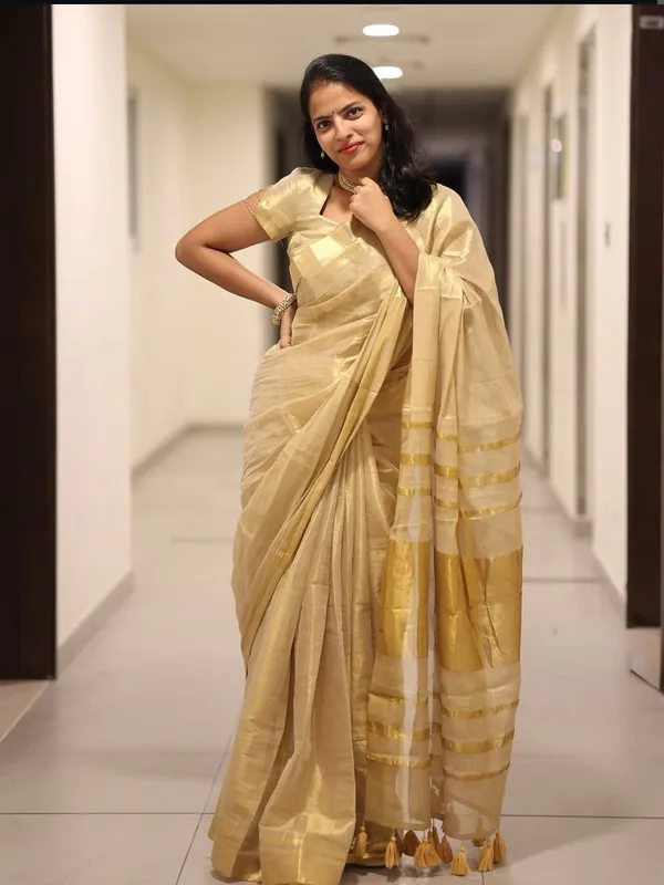 Golden_Beige_Soft_Linen_Saree_With_Zari_Stripes_Tassel_Border