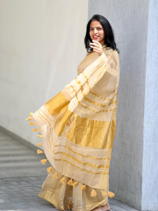 Golden_Beige_Soft_Linen_Saree_With_Zari_Stripes_Tassel_Border