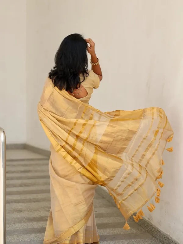 Golden_Beige_Soft_Linen_Saree_With_Zari_Stripes_Tassel_Border