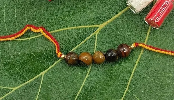 Designer_Tiger_Eye_5_Beads_Crystal_Stone_Rakhi|_Real_Gemstone_Rakhi_For_Brother_Pearl_Rakhi_by_Multiagate_(Real_Gemstone,_Charm_Bracelet,_Crystal_Stone)