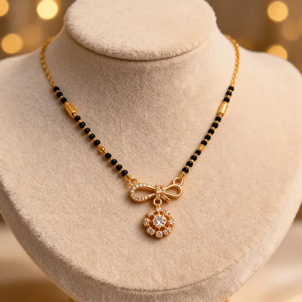 Gold_And_Black_Metal_Beaded_Bow_Floral_Pendant_Mangalsutra_For_Women
