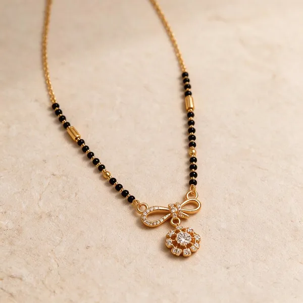 Gold_And_Black_Metal_Beaded_Bow_Floral_Pendant_Mangalsutra_For_Women