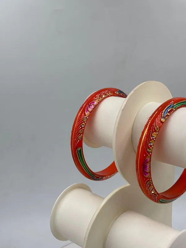 Shreenathji_Gold_Minimalist_Everyday_Traditional_Hand_Painted_22K_Gold_Bound_Orange_Plastic_Base_Bangles_(Pack_Of_2)