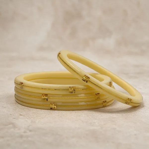Cream_22K_Gold_Plastic_Swastik_Churi_Bangle_Set_For_Women_Pack_Of_4