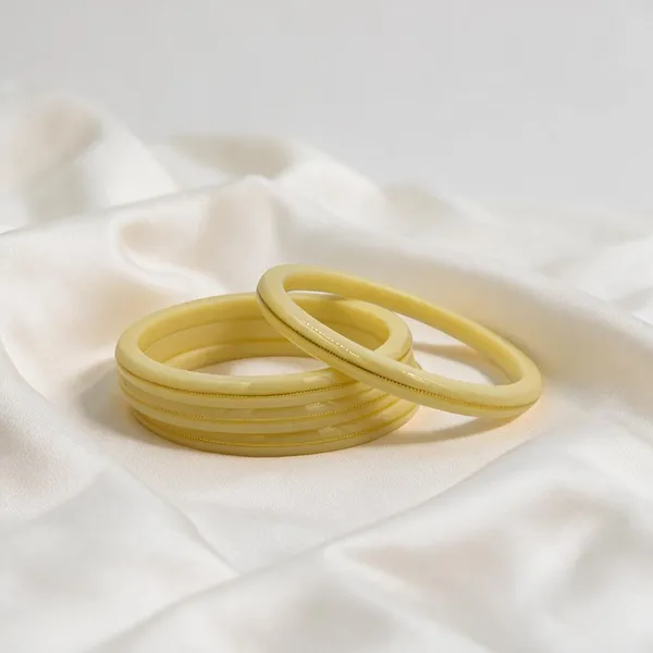 Cream_Ivory_22K_Gold_Plastic_Churi_Bangle_Set_For_Women_Pack_Of_2