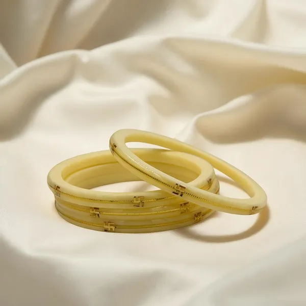 Cream_Gold-Tone_Plastic_Swastik_Motif_Bangle_Set_For_Women_Pack_Of_4