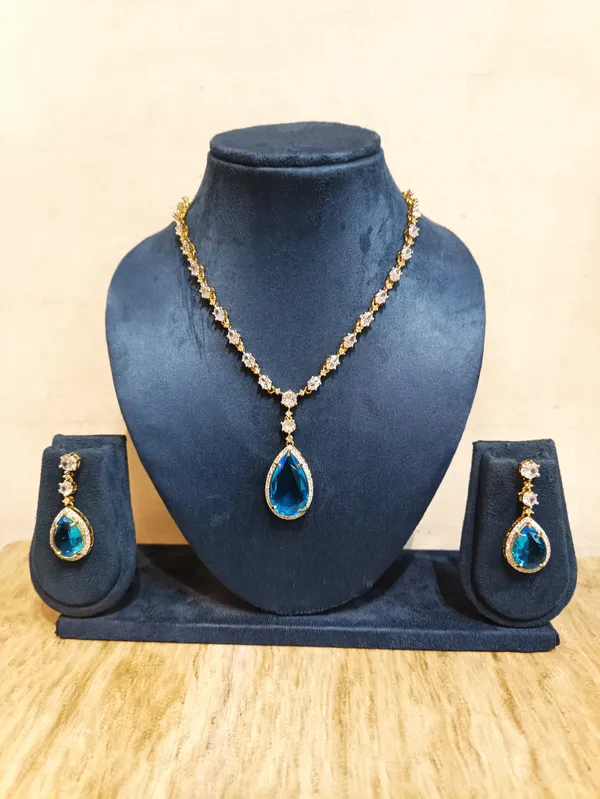 Gold_Brass_Blue_Stone_Necklace_And_Earrings_Set_For_Women