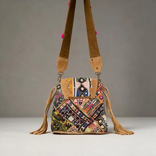 Mustard_Cotton_And_Sued_Leather_Banjara_Potli_Bag_For_Women