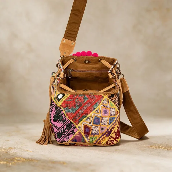 Mustard_Cotton_And_Sued_Leather_Banjara_Potli_Bag_For_Women