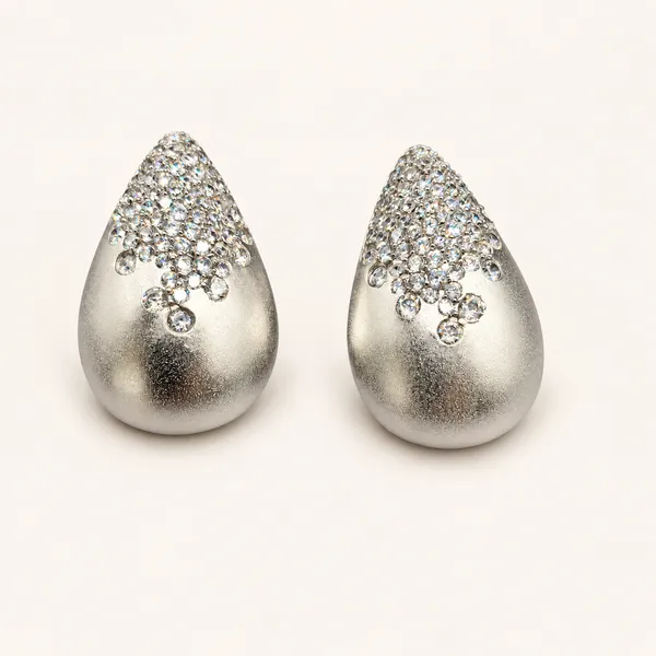 Teardrop_stud_earrings_with_textured_finish_and_clear_stone_detailing_|_Silver_tone_/_clear