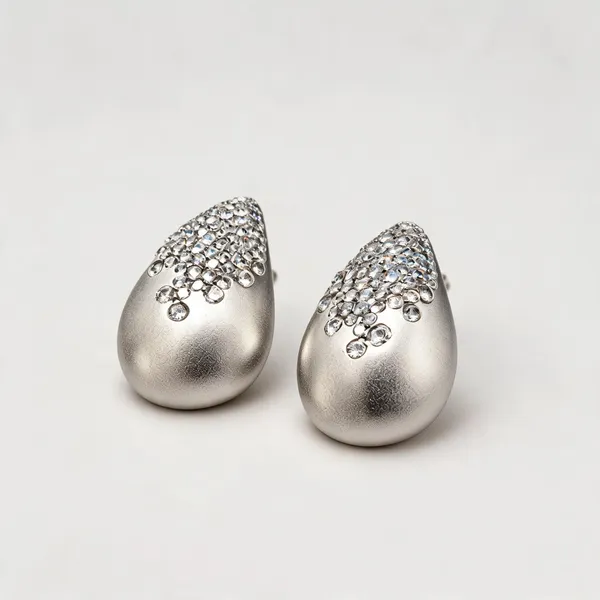 Teardrop_Stud_Earrings_With_Textured_Finish_And_Clear_Stone_Detailing_|_Silver_Tone_/_Clear